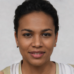 Joyful latino young-adult female with short  brown hair and brown eyes