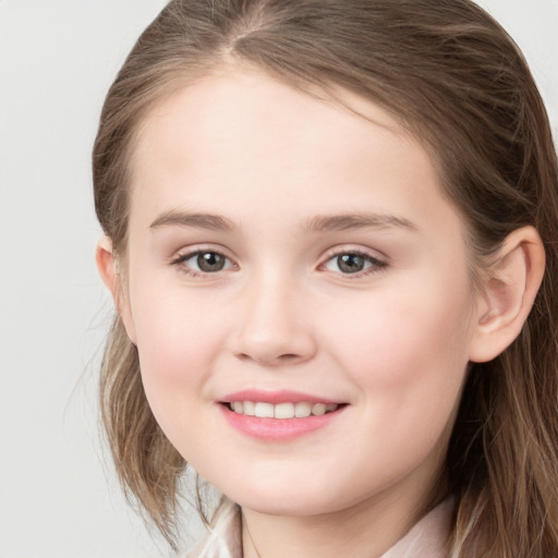 Joyful white child female with long  brown hair and grey eyes