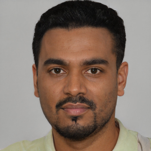 Neutral black young-adult male with short  black hair and brown eyes