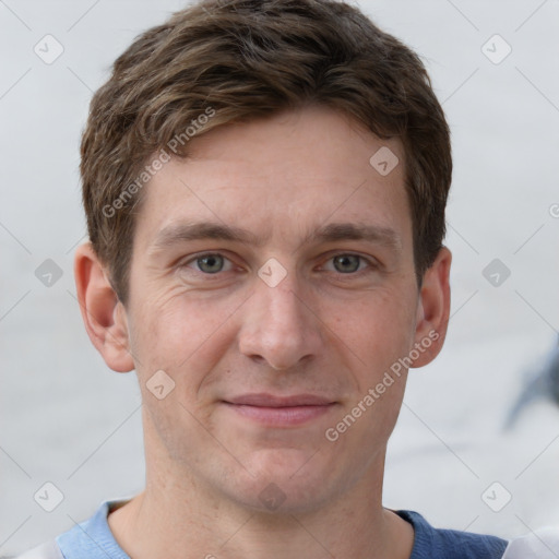 Joyful white adult male with short  brown hair and grey eyes