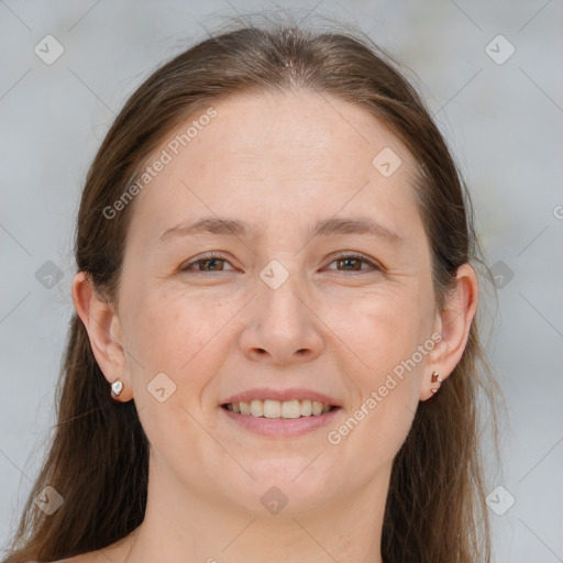 Joyful white adult female with medium  brown hair and brown eyes