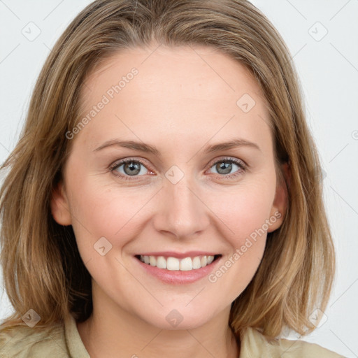 Joyful white young-adult female with medium  brown hair and blue eyes