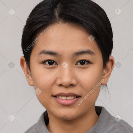 Joyful asian young-adult female with short  black hair and brown eyes