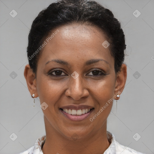 Joyful black young-adult female with short  brown hair and brown eyes