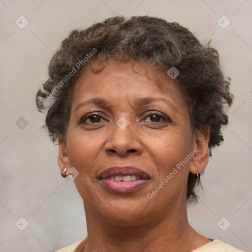 Joyful black adult female with short  brown hair and brown eyes