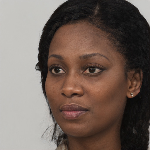 Neutral black young-adult female with long  black hair and brown eyes