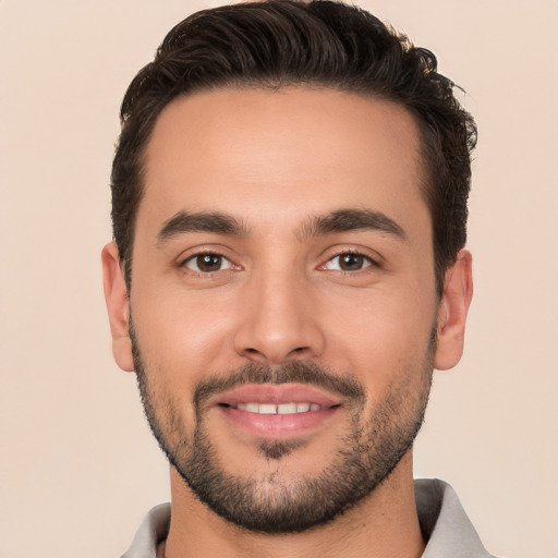 Joyful white young-adult male with short  brown hair and brown eyes