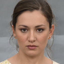 Neutral white young-adult female with medium  brown hair and brown eyes