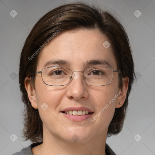 Joyful white adult female with medium  brown hair and grey eyes