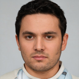Neutral white young-adult male with short  black hair and brown eyes