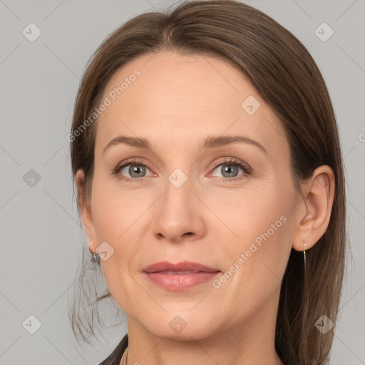 Joyful white adult female with medium  brown hair and grey eyes