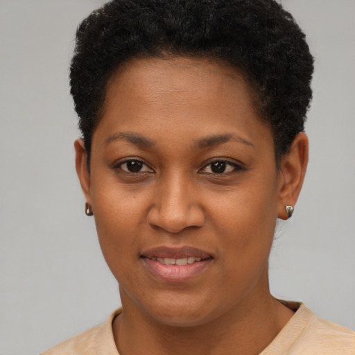 Joyful black young-adult female with short  brown hair and brown eyes