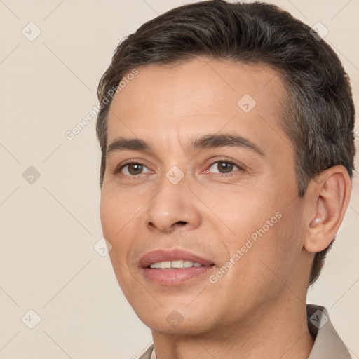 Joyful white adult male with short  brown hair and brown eyes