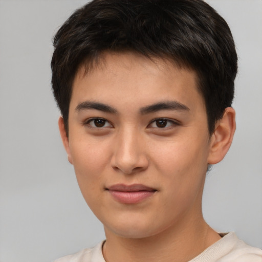 Joyful asian young-adult male with short  brown hair and brown eyes