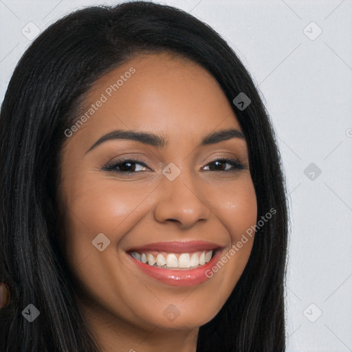 Joyful latino young-adult female with long  brown hair and brown eyes