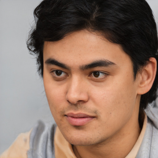 Joyful white young-adult male with medium  brown hair and brown eyes