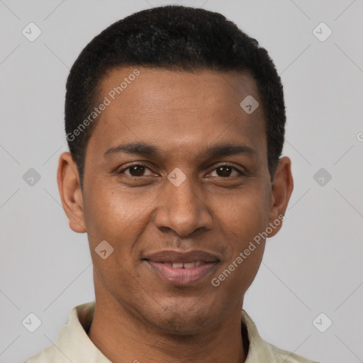 Joyful black young-adult male with short  brown hair and brown eyes