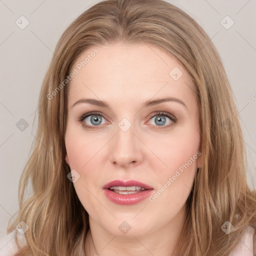 Joyful white young-adult female with long  brown hair and blue eyes