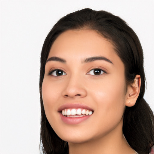 Joyful white young-adult female with long  black hair and brown eyes