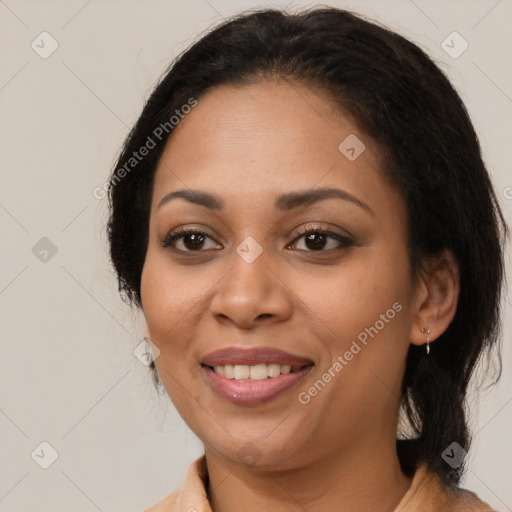 Joyful latino young-adult female with medium  brown hair and brown eyes