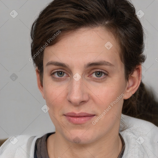 Joyful white adult female with short  brown hair and brown eyes