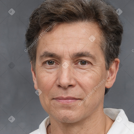 Joyful white middle-aged male with short  brown hair and brown eyes