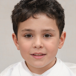 Joyful white child male with short  brown hair and brown eyes