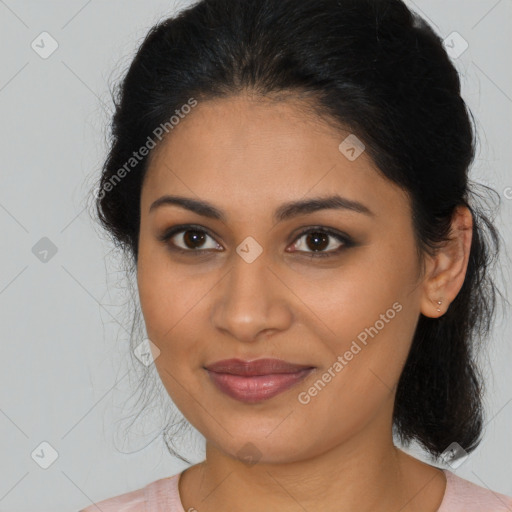 Joyful latino young-adult female with medium  brown hair and brown eyes