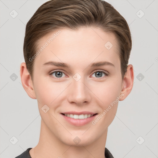 Joyful white young-adult female with short  brown hair and grey eyes