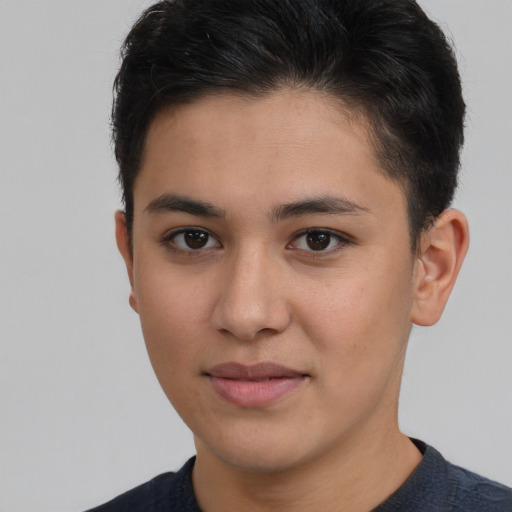 Joyful latino young-adult male with short  brown hair and brown eyes