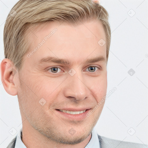 Joyful white young-adult male with short  brown hair and grey eyes