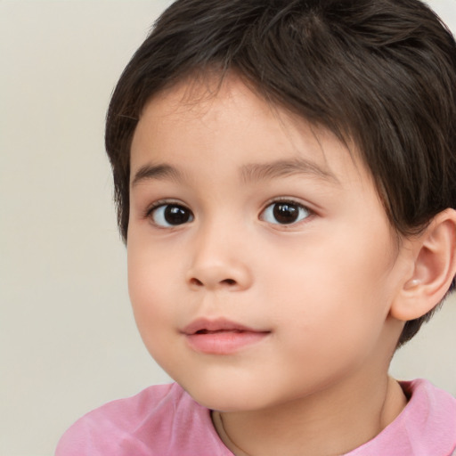 Joyful white child female with short  brown hair and brown eyes