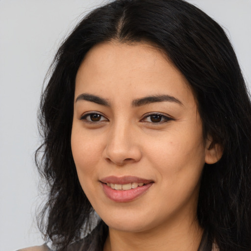 Joyful asian young-adult female with long  brown hair and brown eyes