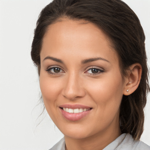 Joyful white young-adult female with medium  brown hair and brown eyes