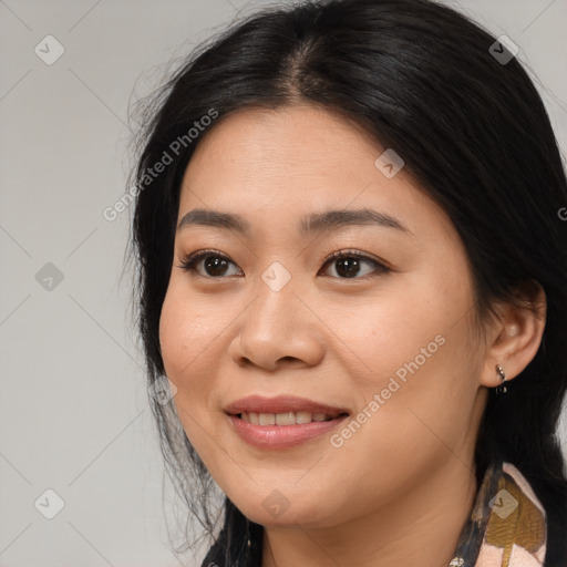 Joyful asian young-adult female with medium  brown hair and brown eyes