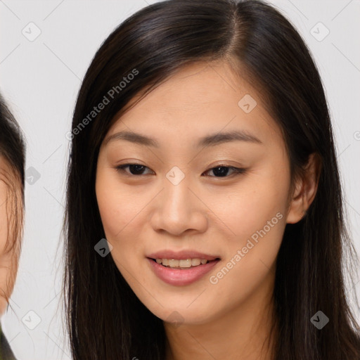 Joyful asian young-adult female with long  brown hair and brown eyes