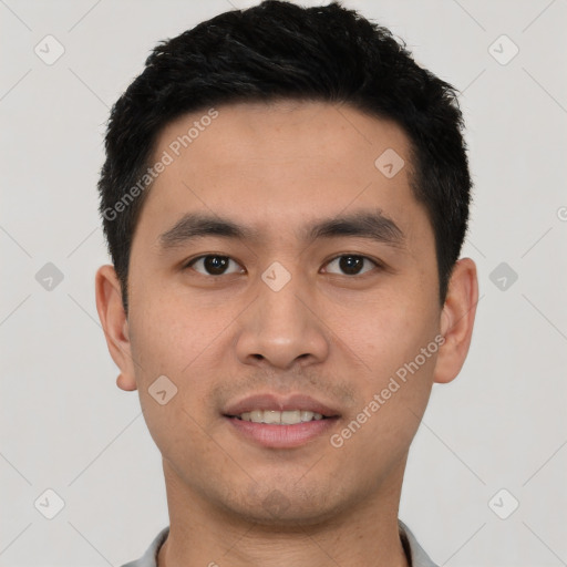 Joyful asian young-adult male with short  black hair and brown eyes