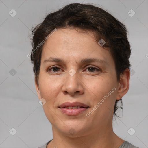 Joyful white adult female with short  brown hair and brown eyes