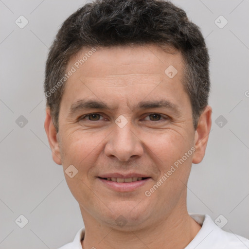 Joyful white adult male with short  brown hair and brown eyes