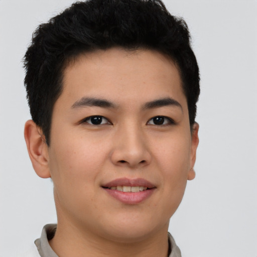 Joyful asian young-adult male with short  brown hair and brown eyes