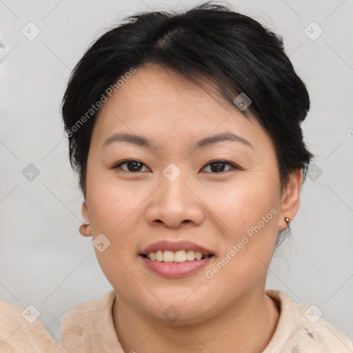 Joyful asian young-adult female with short  brown hair and brown eyes