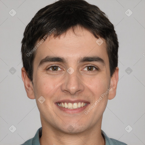 Joyful white young-adult male with short  black hair and brown eyes