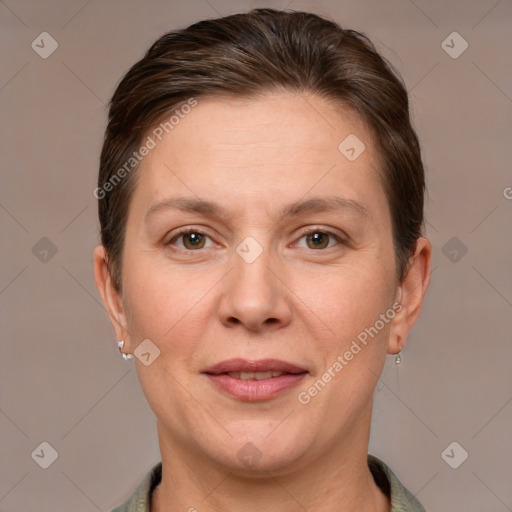 Joyful white adult female with short  brown hair and grey eyes