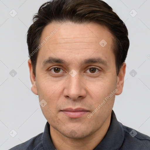 Joyful white adult male with short  brown hair and brown eyes