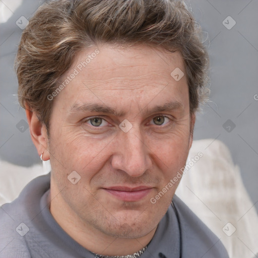 Joyful white adult male with short  brown hair and grey eyes