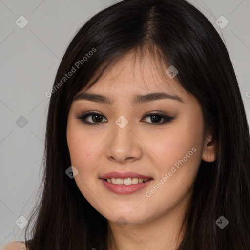 Joyful asian young-adult female with long  brown hair and brown eyes