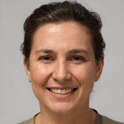 Joyful white adult female with short  brown hair and brown eyes