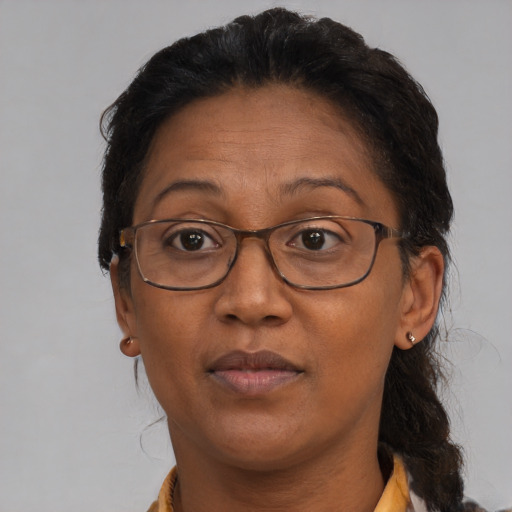 Neutral black adult female with medium  brown hair and brown eyes