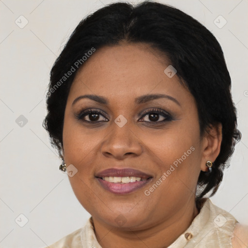 Joyful black adult female with medium  brown hair and brown eyes