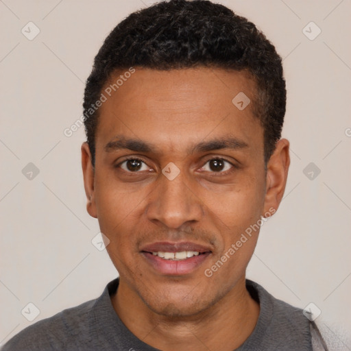 Joyful black young-adult male with short  black hair and brown eyes